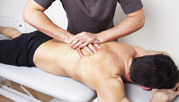 physical therapist applying myofascial therapy