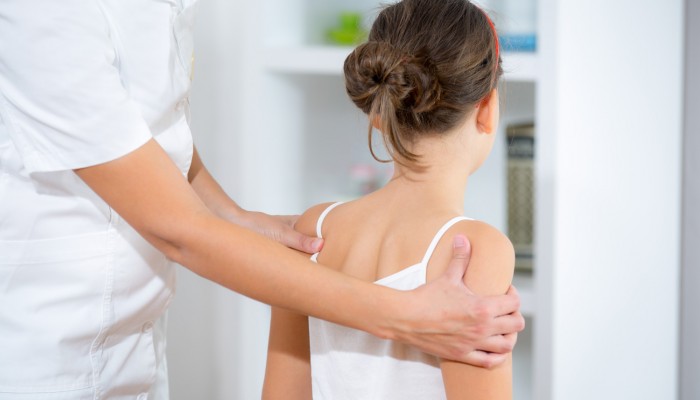Chiropractor doing adjustment on female patient